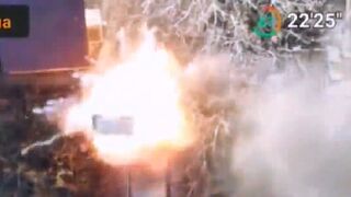 Ukrainian UAV dropping a 40mm grenade through the hatch of an abandoned Russian BMP-3