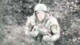 Russian soldier surrenders to Ukrainian drone outside Bakhmut.