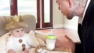 Funny daddy serves his baby's meal
