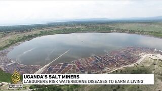 Ugandan salt miners risk their health for meagre pay at Lake Katwe.