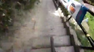 Racing at the world's longest urban descent race on stairs in Colombia.