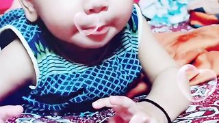Baby licking sour Achaar