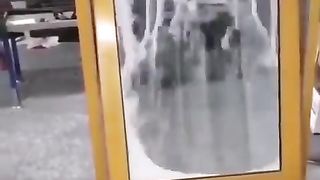 This window gives you privacy by using falling sand for blinds