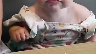 Cute babies trying lemon