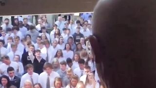 400 students gather outside the home of their cancer-stricken teacher to sing for him. He passed away 10 days later