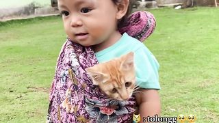 baby holding baby