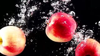 Apples falling through water