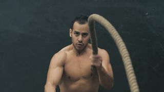 Man doing rope exercise