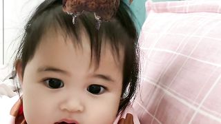 baby smiles cheerfully
