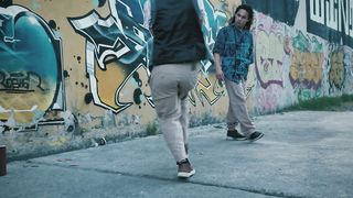 Two young men in a dance duel