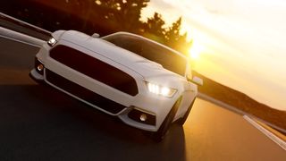 Luxury white sports car in the highway at sunset
