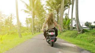 Happy couple in a funny trip on motorcycle