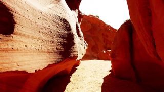 Passing between rock formations in the desert