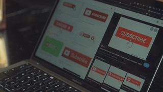 Close-up shot of scrolling through and selecting search results in a browser on a laptop