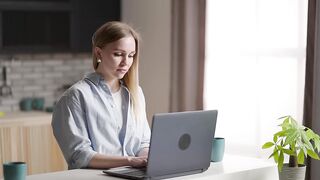 Office Stock Footage - Woman Scrolling/Working On Laptop - 4k Free Workspace Background