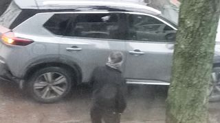 A man is waiting for a car to give a gift on February 14