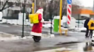 Ded Moroz on an electric unicycle
