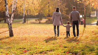 Family walking in the park, full shot