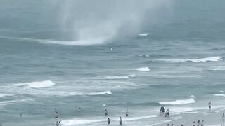 Footage captures waterspout ripping through crowded beach Shorts