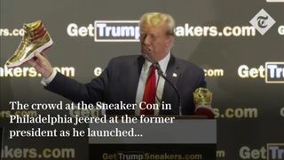 Donald Trump booed as he unveils new $399 trainers in surprise appearance