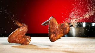 Chicken wings falling in slow motion