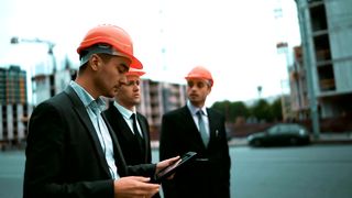 Architect talking to businessmen