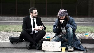 Businessman with homeless on the street
