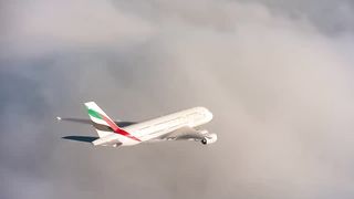 Jetman flying next to the Emirates A380 in Dubai