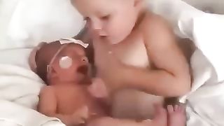 Cute sisters take care of newborn babies