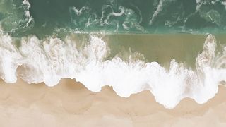Sea waves hitting the sandy