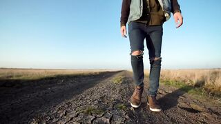 A man is walking on rural path