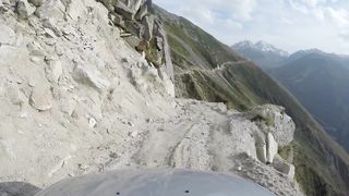 Car driving through a narrow mountain road
