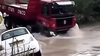 The car went swimming after passing the truck