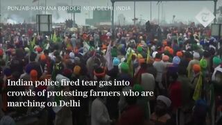 Indian police fire tear gas into crowds of protesting farmers