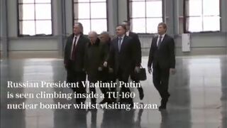 Putin climbs inside a TU-160 nuclear bomber
