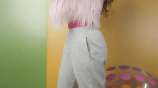 Cheerful girl recording herself with a colorful background