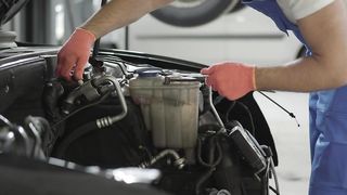 Mechanic repairing a car engine