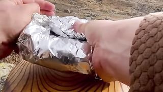 cooking beef sausage burgers on the mountain