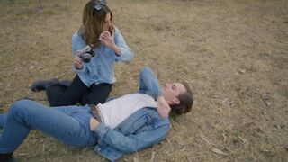 Couple having fun with a polaroid camera
