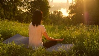 Woman doing yoga outdoors