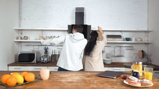 Happy couple dancing in a kitchen