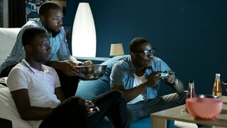 Friends having fun with video games