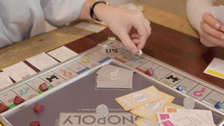 Friends playing Monopoly