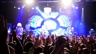 Audience clapping in concert