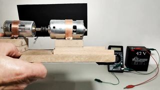 Two dynamo electric motors connected via the axes