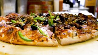sliced ​​black olive peperonni pizza