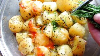 very beautiful little roasted potatoes and aromatic plant cutting