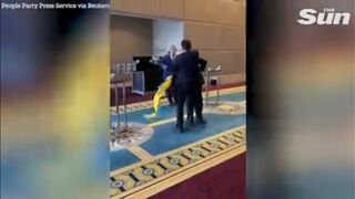 Fist fight erupts when Russian diplomat rips down Ukrainian flag at conference