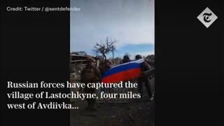 Russian troops raise flag in a village near Avdiivka