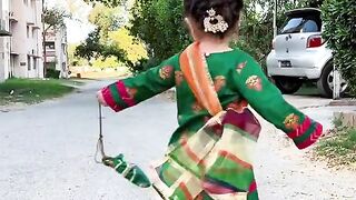 Child dancing with beautiful dress